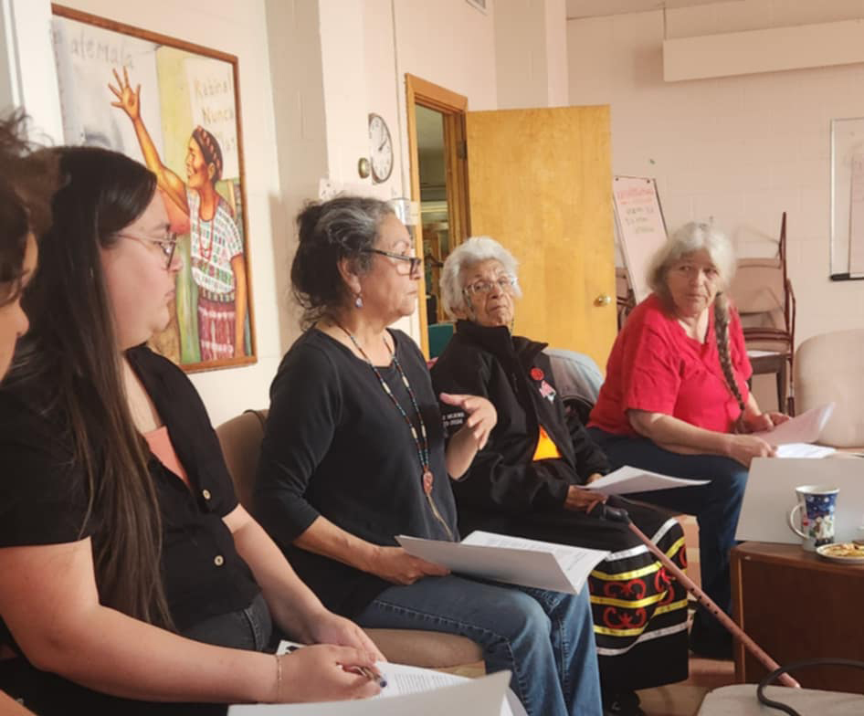 Four women sitting in a room