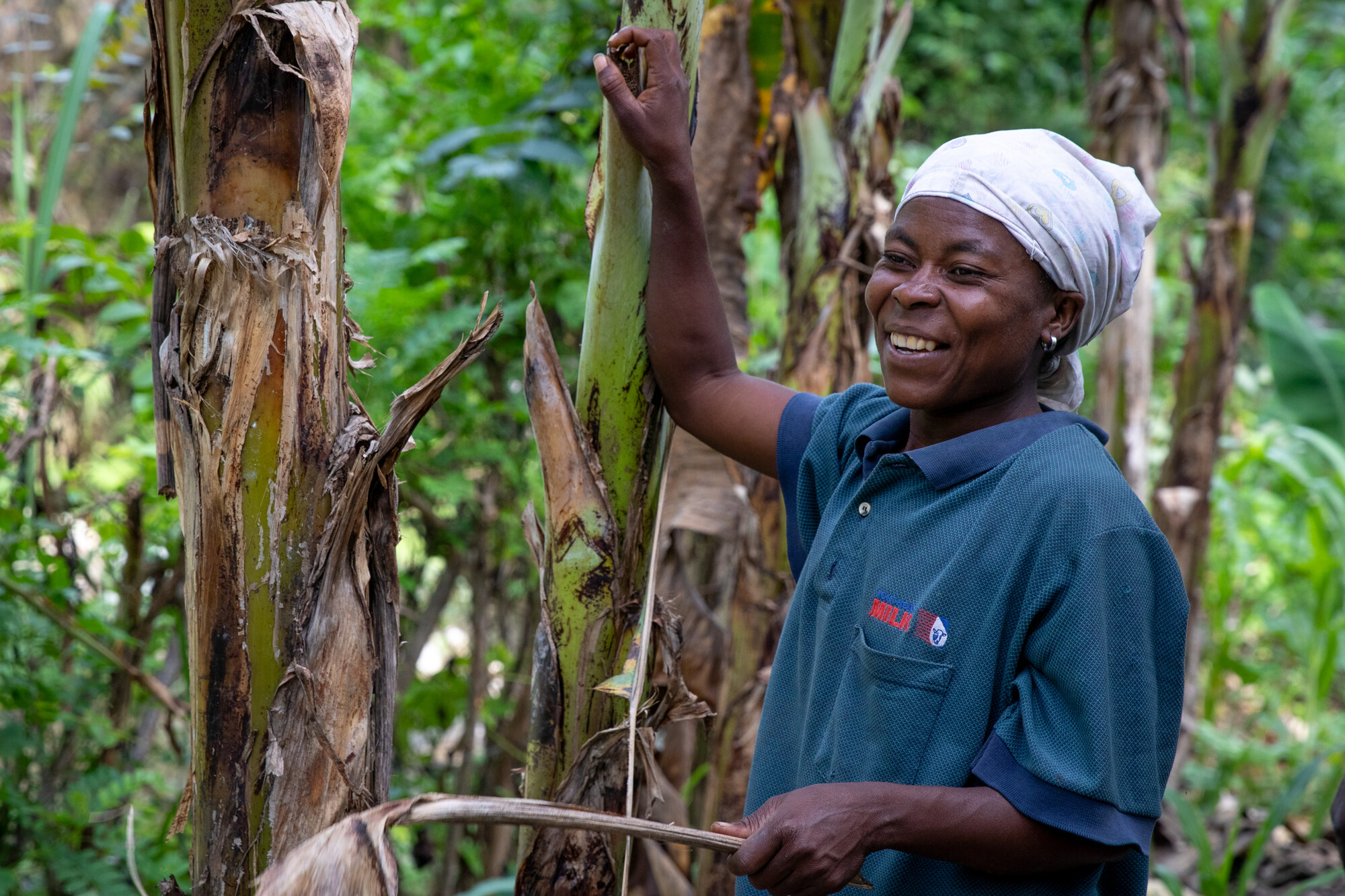 Woman leaning on a tree