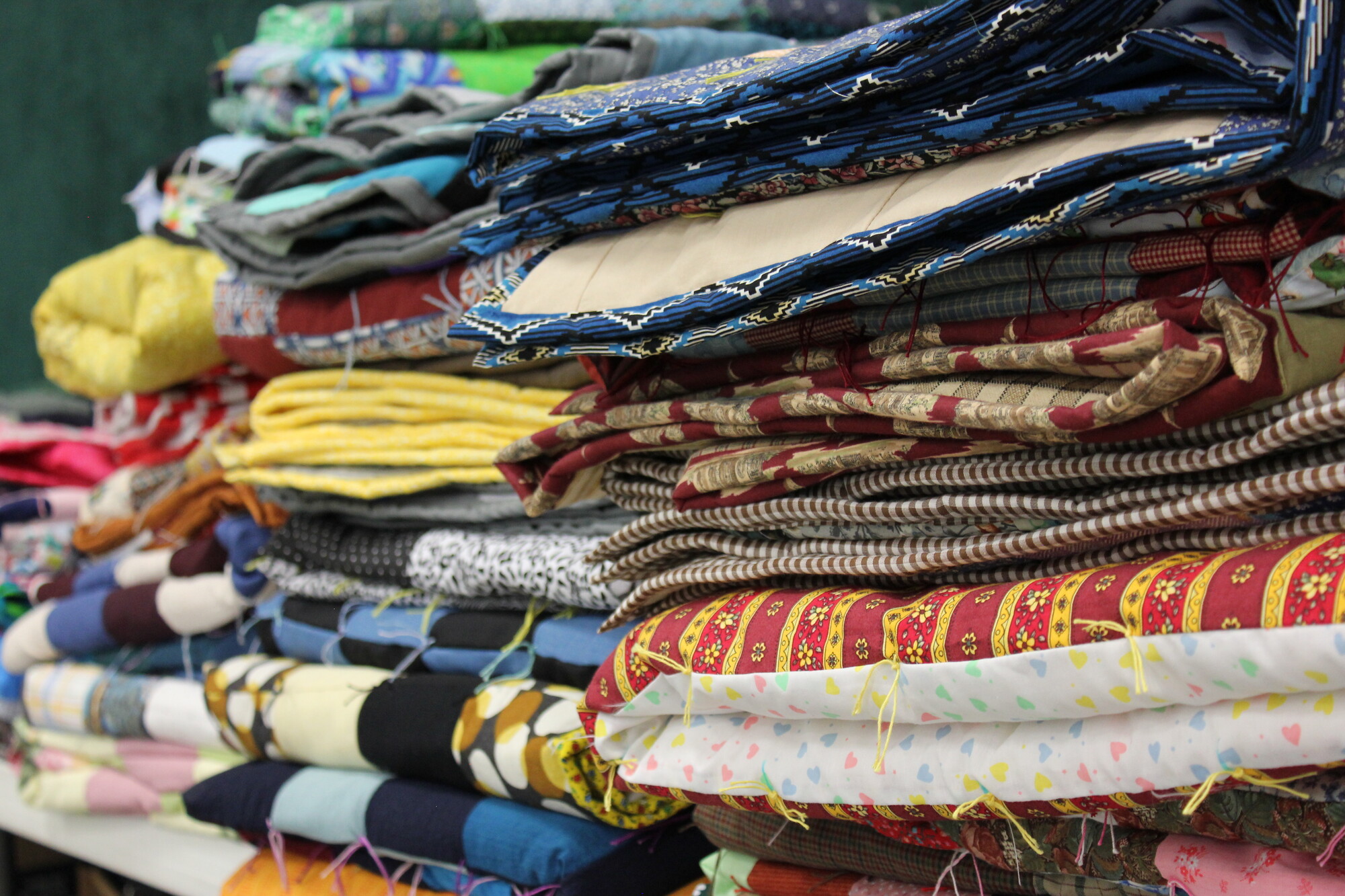 Stacks of colorful comforters