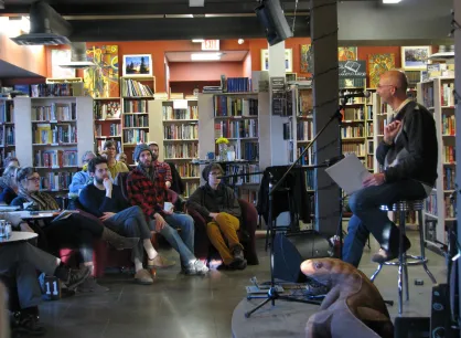 A man speaking to a group of people